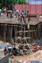 Andhra Pradesh, India: Construction workers working on a building