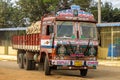 Colorful cargo truck with rich decorative paintings, typical for the trucks in India.