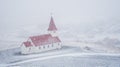 The Vik I Myrdal church at the top of the hill at the village of vik in Iceland in winter