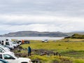 People on car parking of Reynisfjara black beach