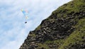 Tandem paragliders flying through the air near Vik
