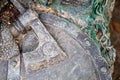 Viking ax lies on the shield of a fallen warrior close-up Royalty Free Stock Photo