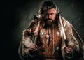 Viking with cold weapon in a traditional warrior clothes Royalty Free Stock Photo