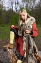 Viking girl with sword in a wood Royalty Free Stock Photo