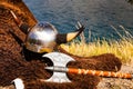 Viking helmet and weapons on fjord shore, Norway Royalty Free Stock Photo