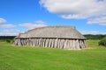 Viking house in the green field. Hobro, Denmark. Royalty Free Stock Photo