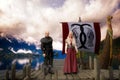 Viking man and woman standing on a pier by a long boat. 3D rendering Royalty Free Stock Photo