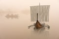 Viking ship on the water in the mystical fog.