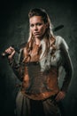 Viking woman with cold weapon in a traditional warrior clothes Royalty Free Stock Photo