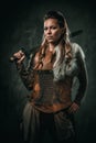 Viking woman with cold weapon in a traditional warrior clothes Royalty Free Stock Photo