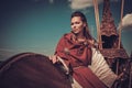 Viking woman with shield on Drakkar. Royalty Free Stock Photo