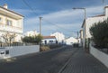 Vila Nova de Milfontes, Portugal, October 25, 2021: Street of Vila Nova de Milfontes white and blue houses in Royalty Free Stock Photo