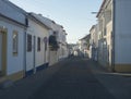 Vila Nova de Milfontes, Portugal, October 25, 2021: View over field to Vila Nova de Milfontes white and blue houses in Royalty Free Stock Photo