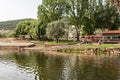 Vila Nova do Ceira, PORTUGAL - June 17, 2022 - Canaveias river beach with people on the grass and swimming in real life