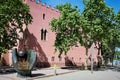 Viladecans - May 20, 2023: The sculpture 'The baseball glove', next to the Red Tower of Viladecans.