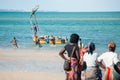 Vilanculos, Mozambique. Working women waiting to buy fish brought by the men in the boats Royalty Free Stock Photo