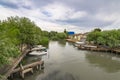 Vilkovo Ã¢â¬â Ukrainian `Venice`. Danube river channel polder street and pier with excursion and fishing boats