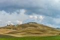 Villa in Italy, old farmhouse in the waves of tuscanian fields and hills Royalty Free Stock Photo