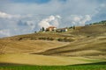 Villa in Italy, old farmhouse in the waves of tuscanian fields and hills Royalty Free Stock Photo