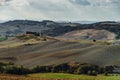 Villa in Italy, old farmhouse in the waves of tuscanian fields and hills Royalty Free Stock Photo