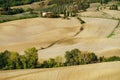 Villa in Italy, old farmhouse in the waves of tuscanian fields and hills Royalty Free Stock Photo