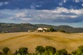 Villa in Italy, old farmhouse in the waves of tuscanian fields and hills Royalty Free Stock Photo