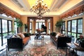 Villa living room surrounded by large windows