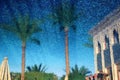 Villa and palm trees reflection in blue pool water. Royalty Free Stock Photo