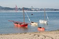 Traditional sailboats anchored on the beach. Old fish boat of Rias Baixas.