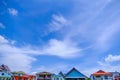 Village against sky clouds, blue fluffy clean, bright weather light summer