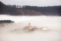 Village in Aramaio valley surrounding by fog Royalty Free Stock Photo