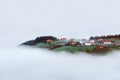 Village in Aramaio valley surrounding by fog Royalty Free Stock Photo