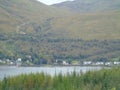 The village of Arrochar nestles at the head of Loch Long as a path heads into the Scottish wilderness Royalty Free Stock Photo