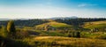 Village and autumn forest in mountains panorama.