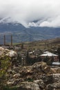 Village in the background of mountains and clouds