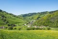 Landscape Black Forest, Germany. Beautiful flowering meadows, hills with trees, windy road, village, Schwarzwald Royalty Free Stock Photo