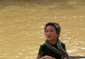 Village boy  with snakes around his necks.  village  on Tonle Sap Lake -Siem Reap, Cambodia 02/21/2011 Royalty Free Stock Photo