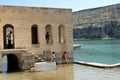 Village boys playing sunken village at Euphrates River