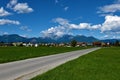 Village Breg and a road at Sorsko polje with peaks of Grintovec and Kocna Royalty Free Stock Photo