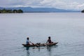 Aerial of Outrigger Canoe Being Paddled in Papua New Guinea