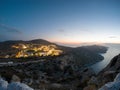 Village Chora illuminated at sunset in Folegandros island Royalty Free Stock Photo