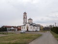 Village church building against gloomy sky during overcast day