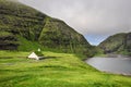 Village church and a lake in Saksun, Faroe Islands, Denmark