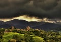 Langhe - The town of Ciglie' under a stormy sky..