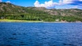 Village on the coast of the Norwegian fjord with a pier for boats Royalty Free Stock Photo