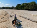 The village cleaning up the beach trash a long the seashore in Mabul Island, Semporna. Tawau, Sabah.