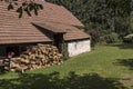 Village cottage with cut wood Royalty Free Stock Photo