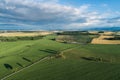 Village country farming shapes in field aerial drone photo