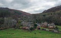 the village of cragg vale in calderdale west yorkshire showing the church and houses between high pennine hills