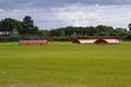 The village cricket ground in Titchfield Common in Hampshire with covers in place in readiness for the weekend match Royalty Free Stock Photo